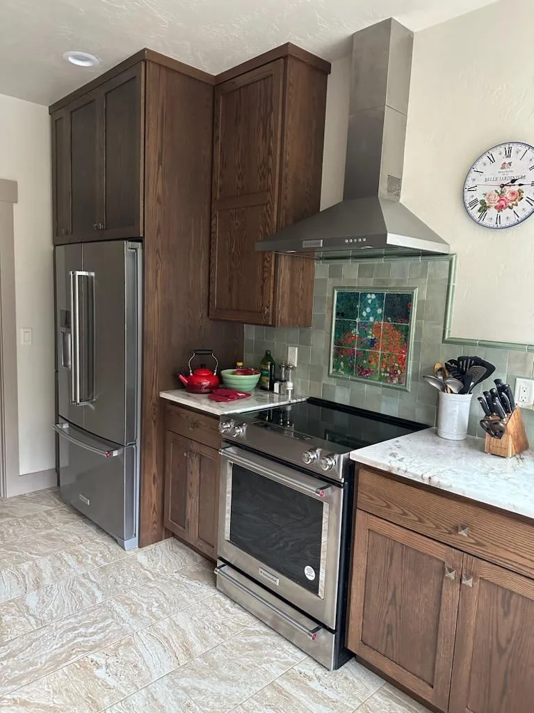 Kitchen with custom cabinetry remodeled by OJEG Construction