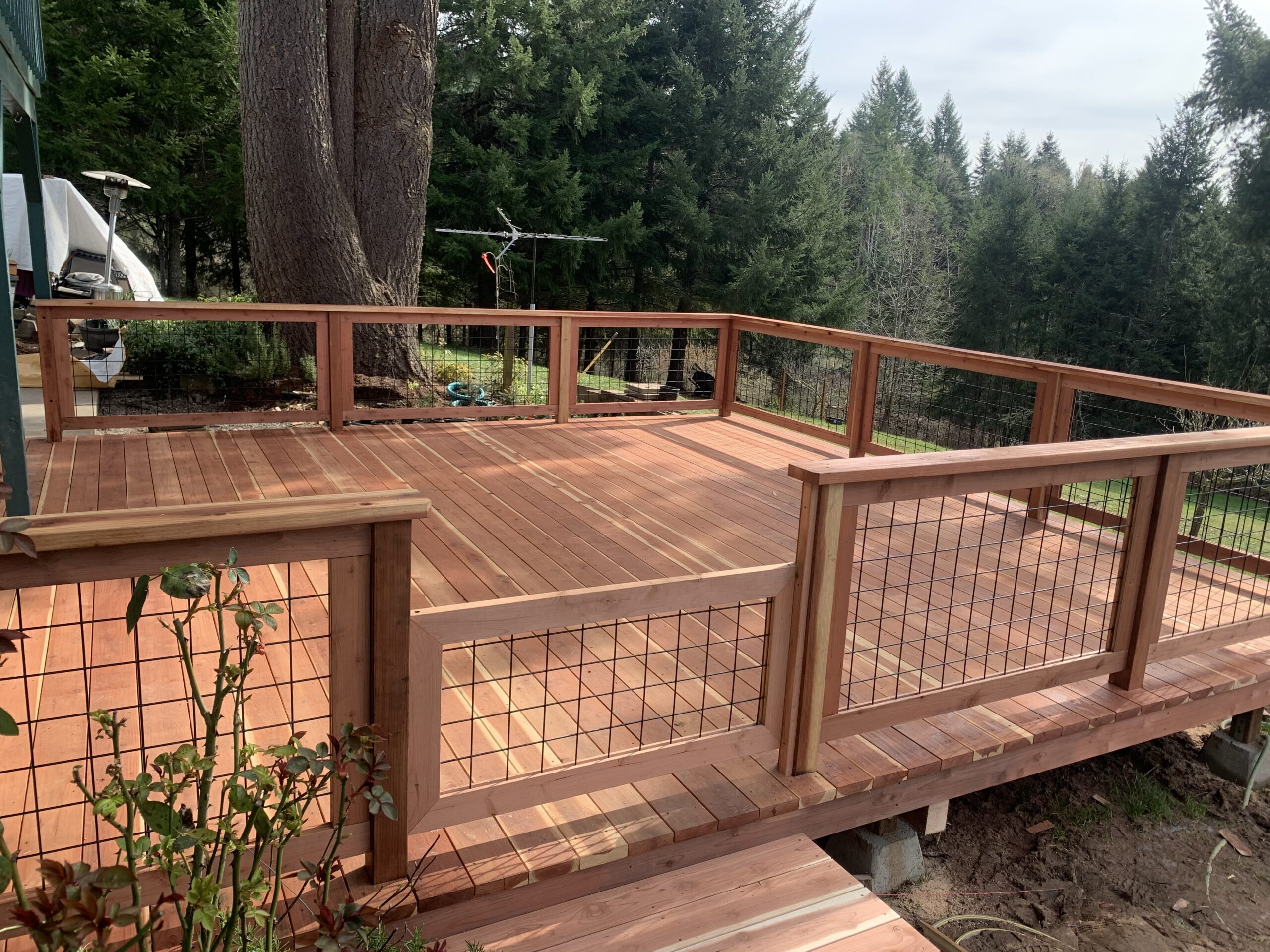 Square wooden deck with fencing