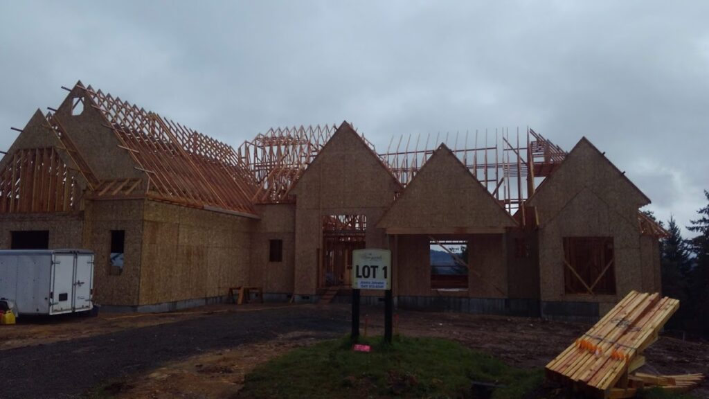 Roof and body framing for a house with some of the initial walls in place